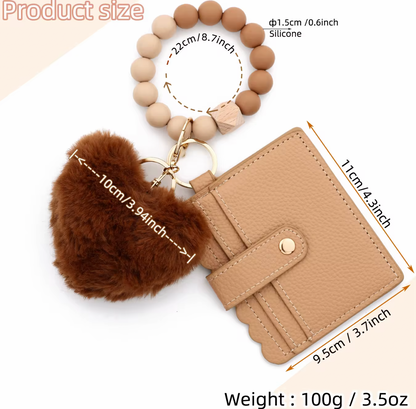 Light Brown wallet with tan and brown silicone beaded wristlet keychain featuring heart shaped pom-pom on a white background